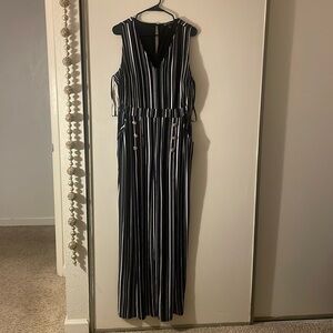 Black and white striped jumpsuit with gold buttons